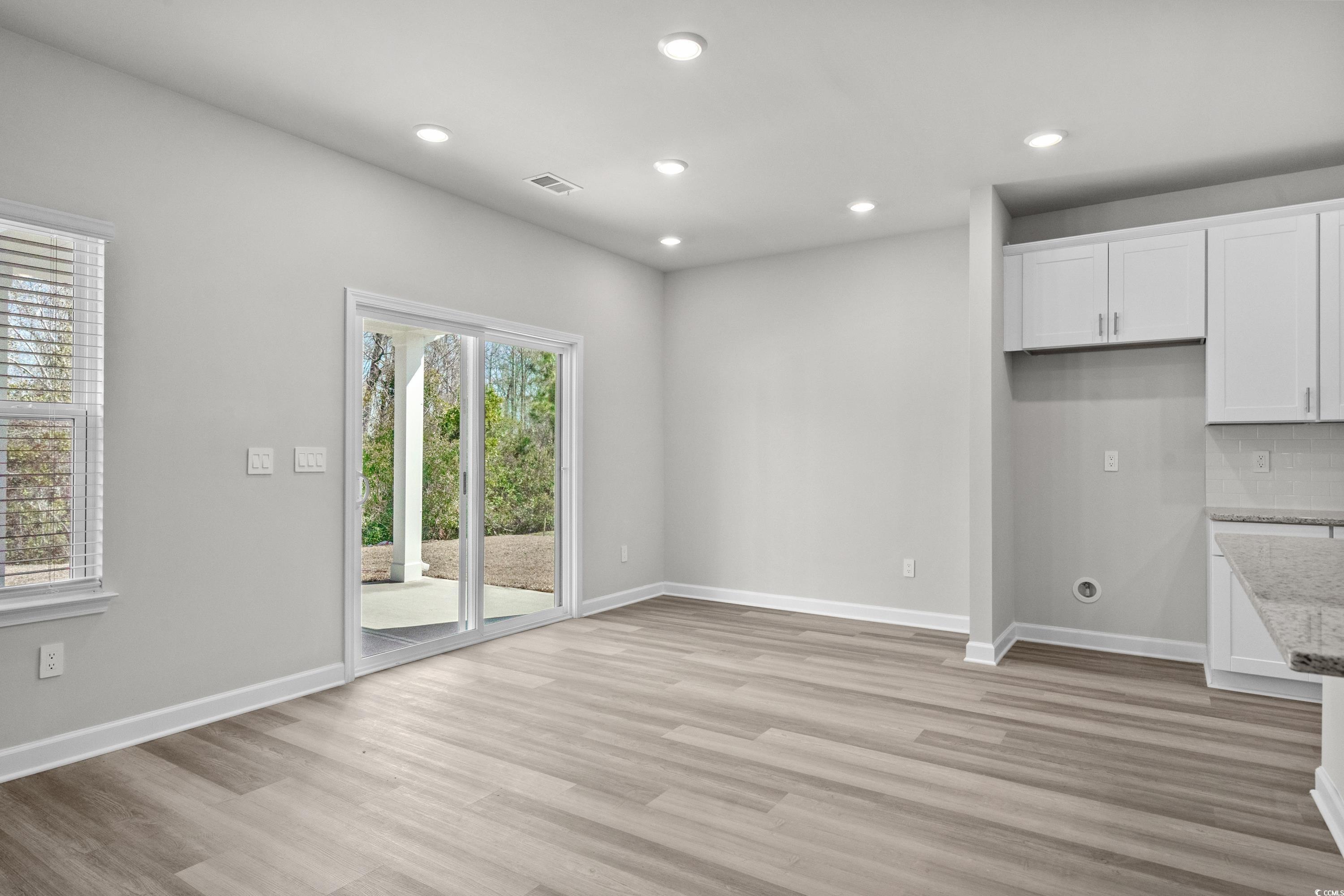 2052 Copper Crk Loop Longs, SC 29568 - Photo 17 of 40 Unfurnished living room featuring baseboards, visi