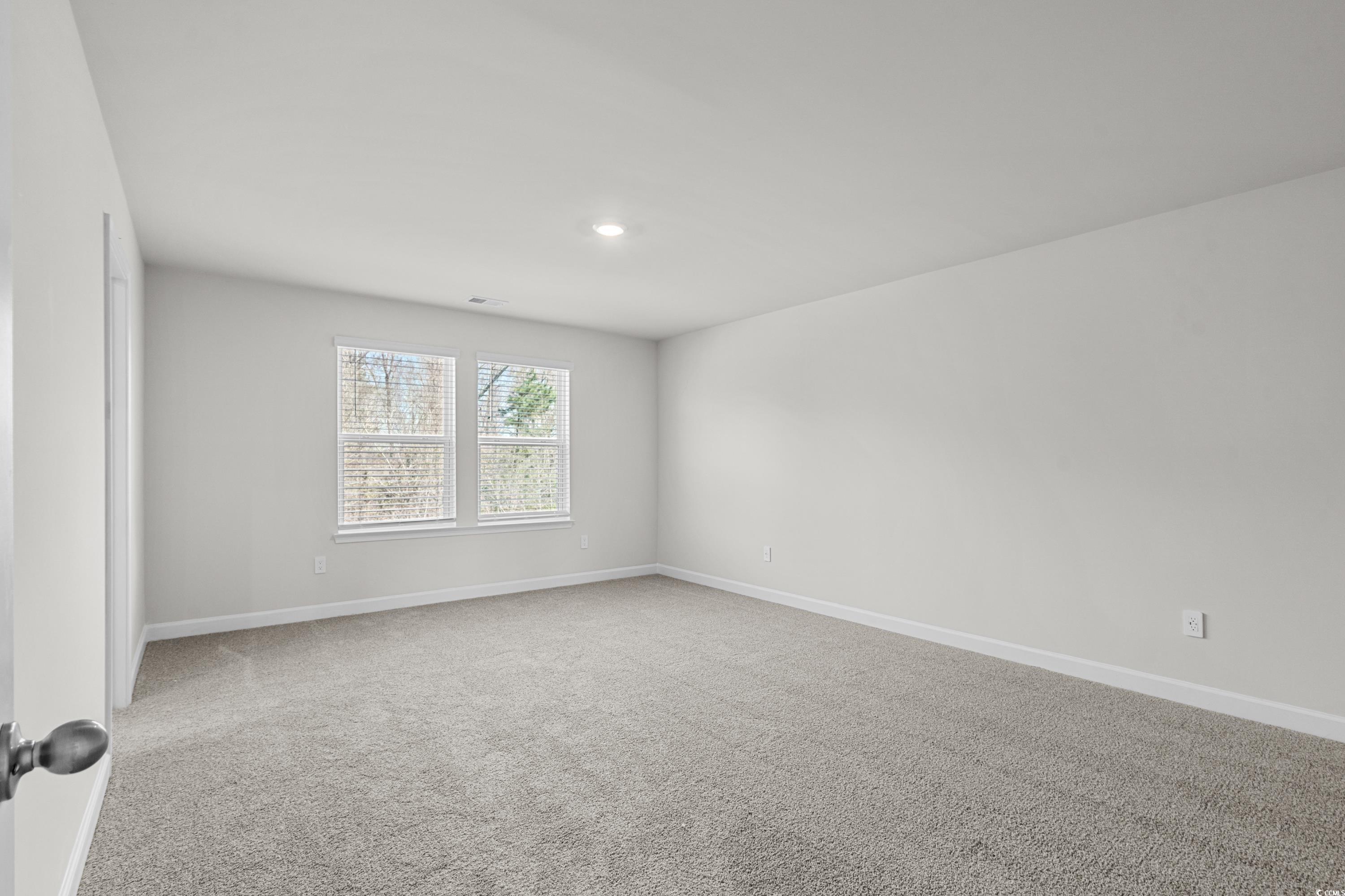 2052 Copper Crk Loop Longs, SC 29568 - Photo 21 of 40 Spare room featuring baseboards, carpet flooring,