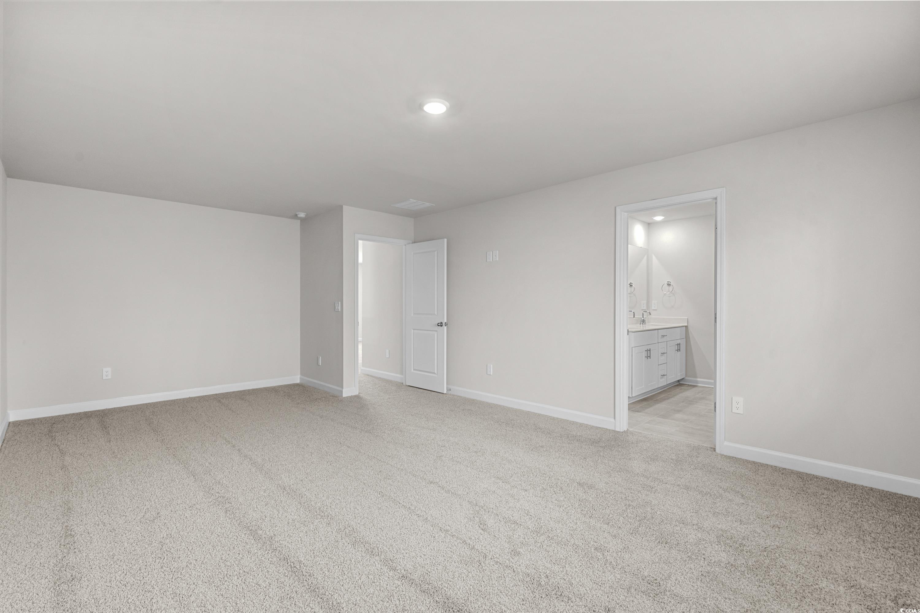 2052 Copper Crk Loop Longs, SC 29568 - Photo 23 of 40 Spare room featuring baseboards, light colored car