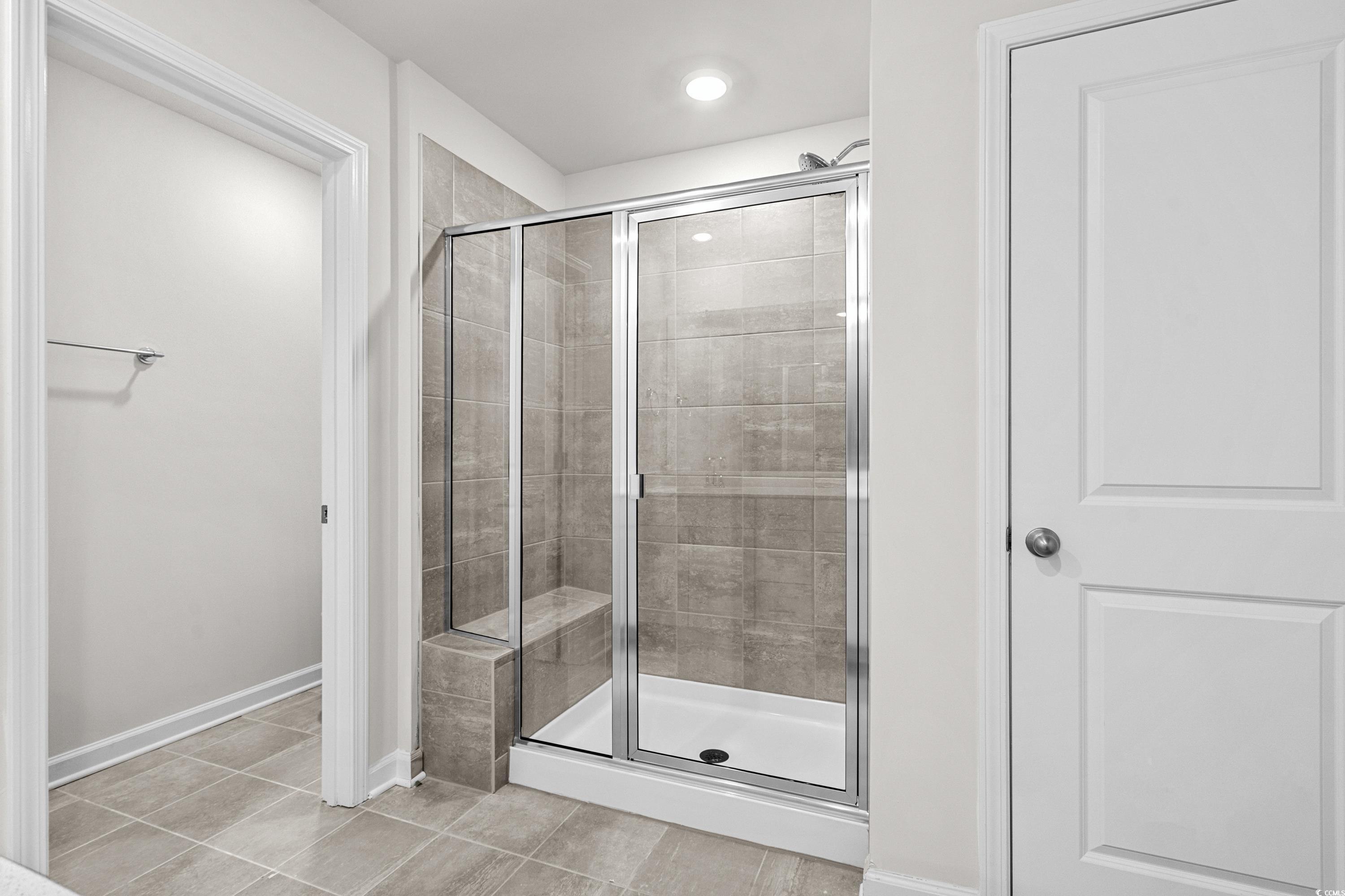 2052 Copper Crk Loop Longs, SC 29568 - Photo 25 of 40 Full bathroom featuring a stall shower, tile patte