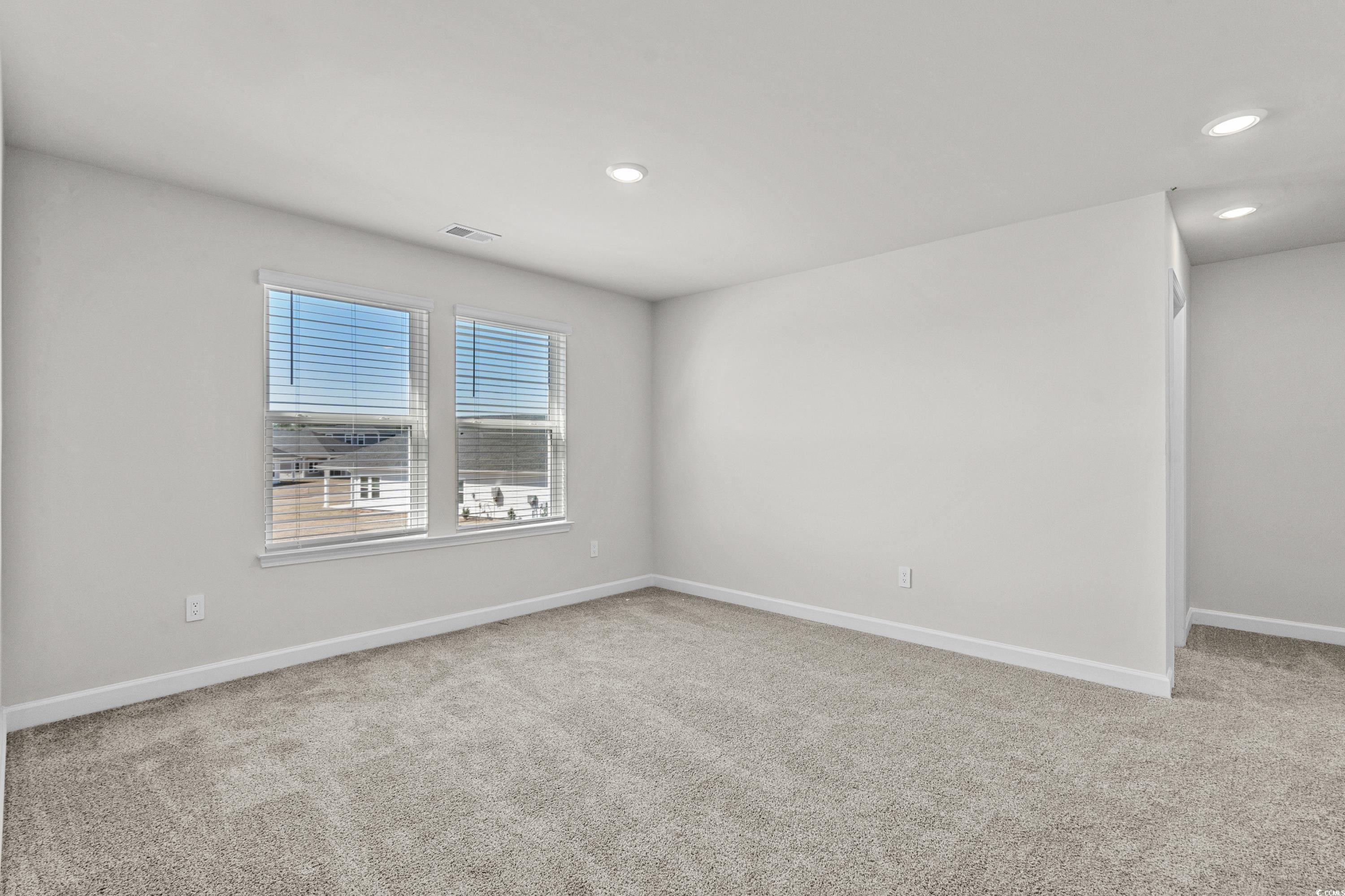 2052 Copper Crk Loop Longs, SC 29568 - Photo 27 of 40 Carpeted empty room featuring recessed lighting, b