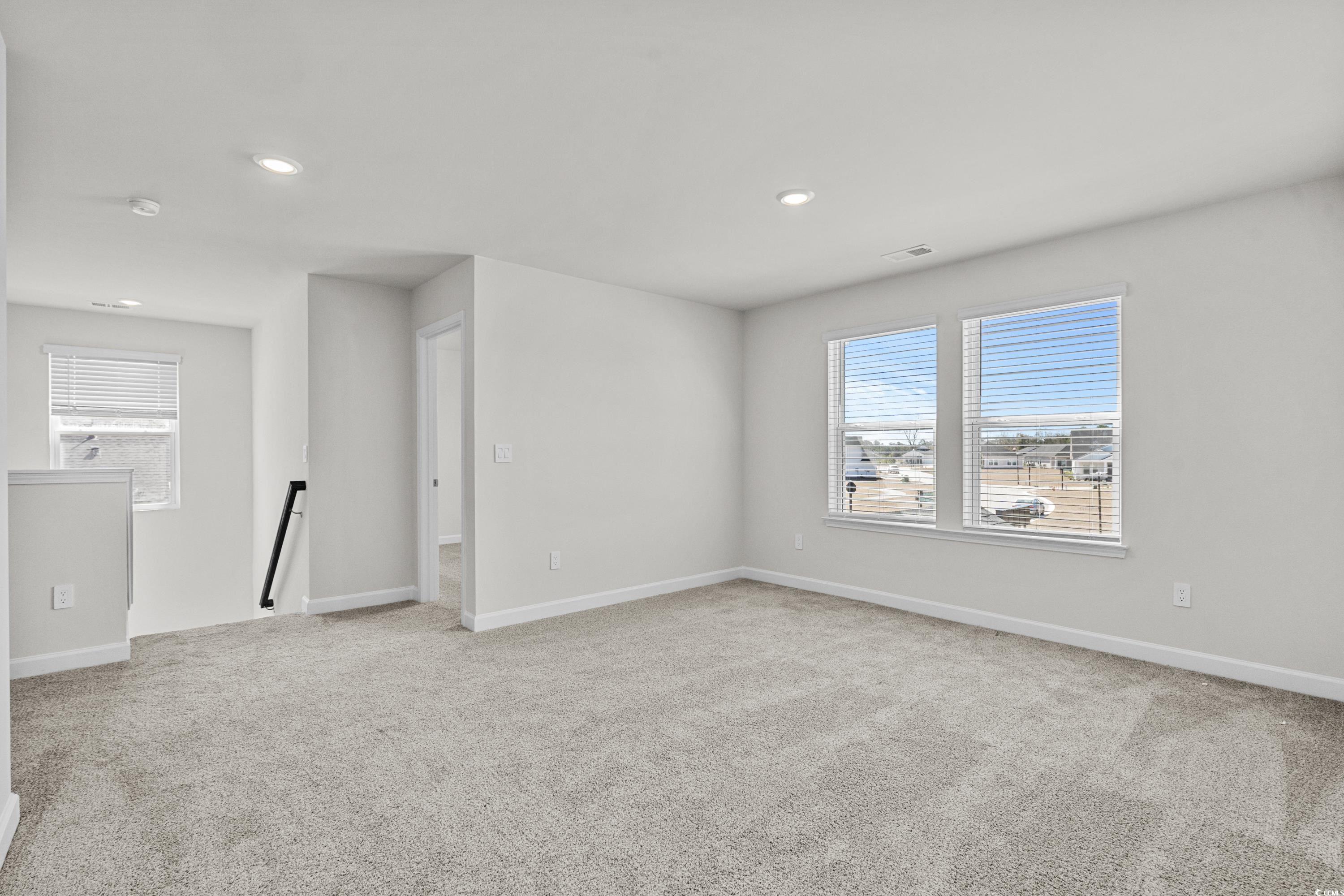 2052 Copper Crk Loop Longs, SC 29568 - Photo 28 of 40 Empty room featuring baseboards, carpet floors, an