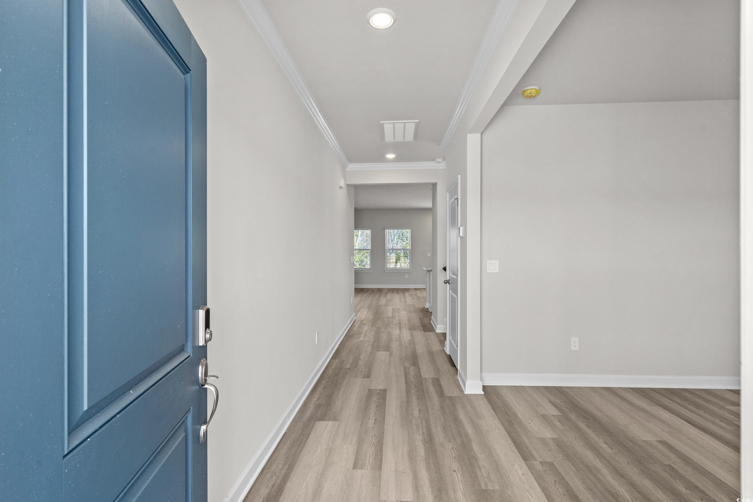 2052 Copper Crk Loop Longs, SC 29568 - Photo 3 of 40 Hall with baseboards, ornamental molding, recessed