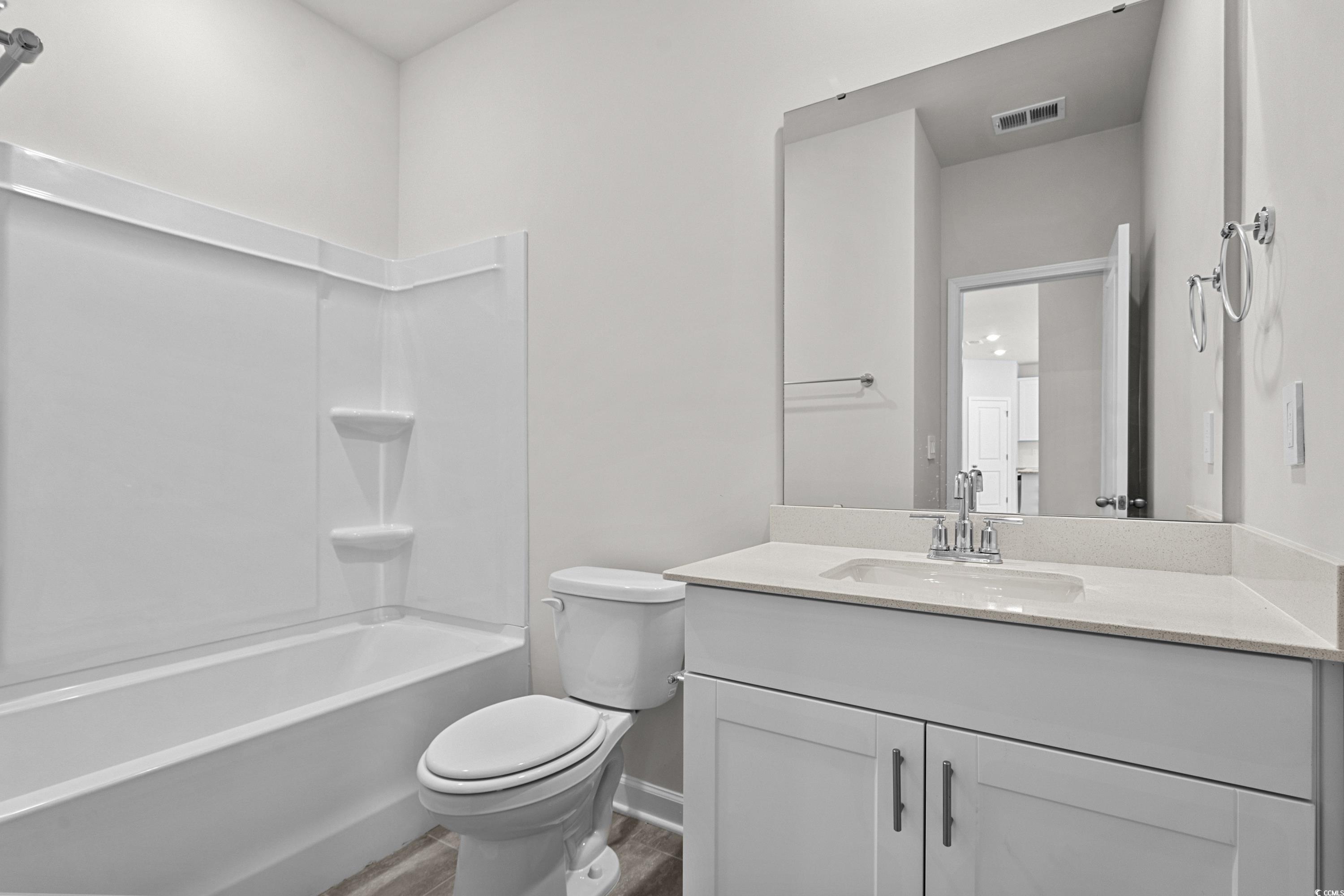 2052 Copper Crk Loop Longs, SC 29568 - Photo 35 of 40 Bathroom with visible vents, toilet, wood finished