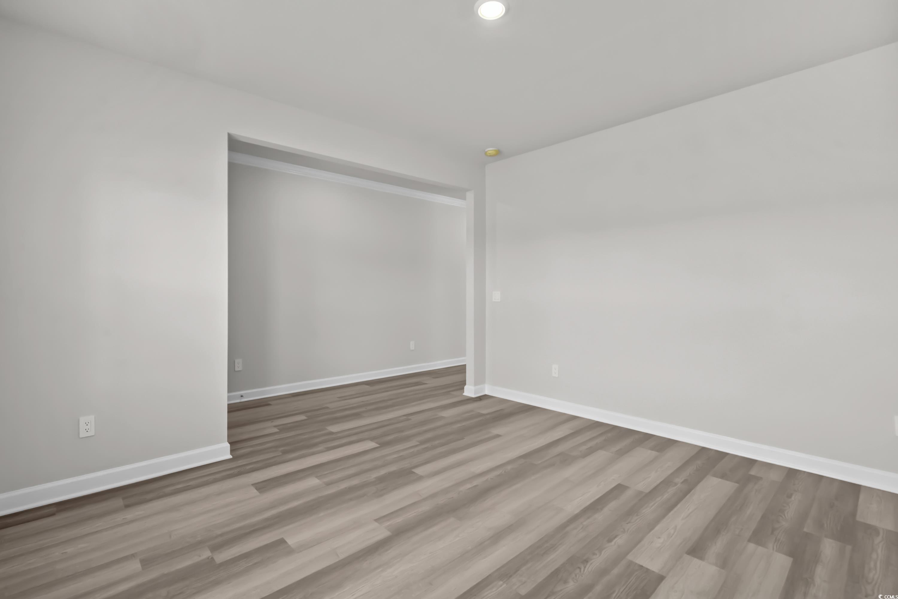 2052 Copper Crk Loop Longs, SC 29568 - Photo 6 of 40 Spare room featuring baseboards, wood finished flo