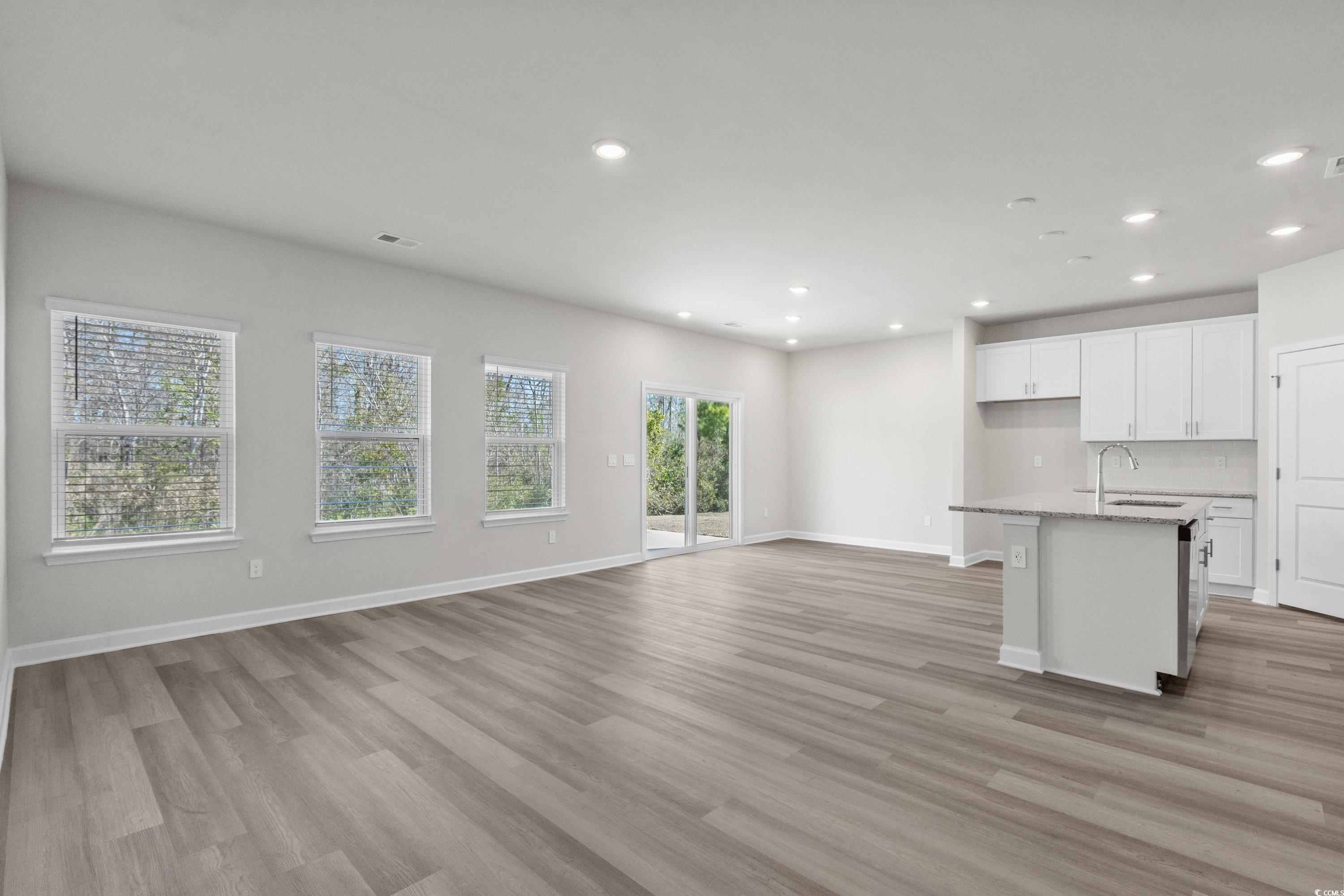 2052 Copper Crk Loop Longs, SC 29568 - Photo 8 of 40 Unfurnished living room with baseboards, recessed