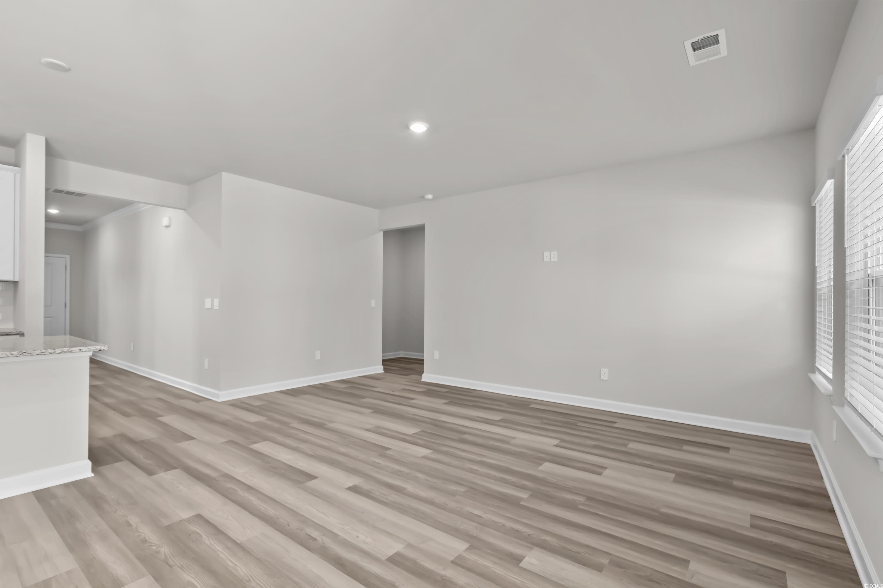 2052 Copper Crk Loop Longs, SC 29568 - Photo 9 of 40 Unfurnished room featuring light wood finished flo