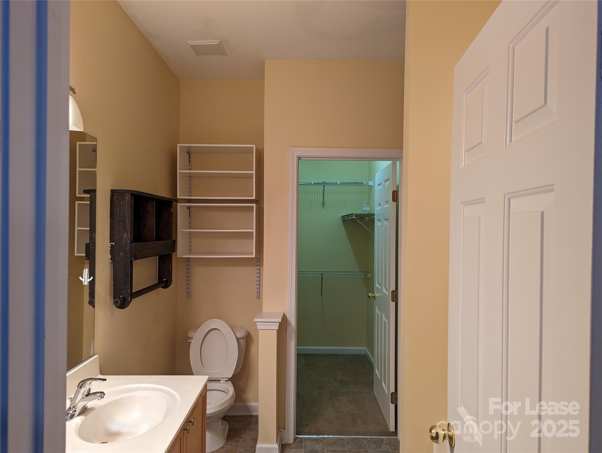 7920 Mariners Pointe Circle Denver, NC 28037 - Photo 14 of 21 a bathroom with a sink and a mirror