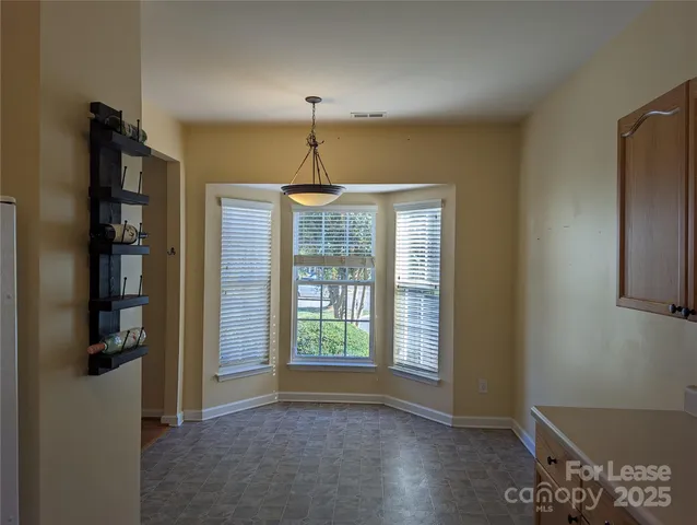 a view of livingroom with window hardwood floor and hallway