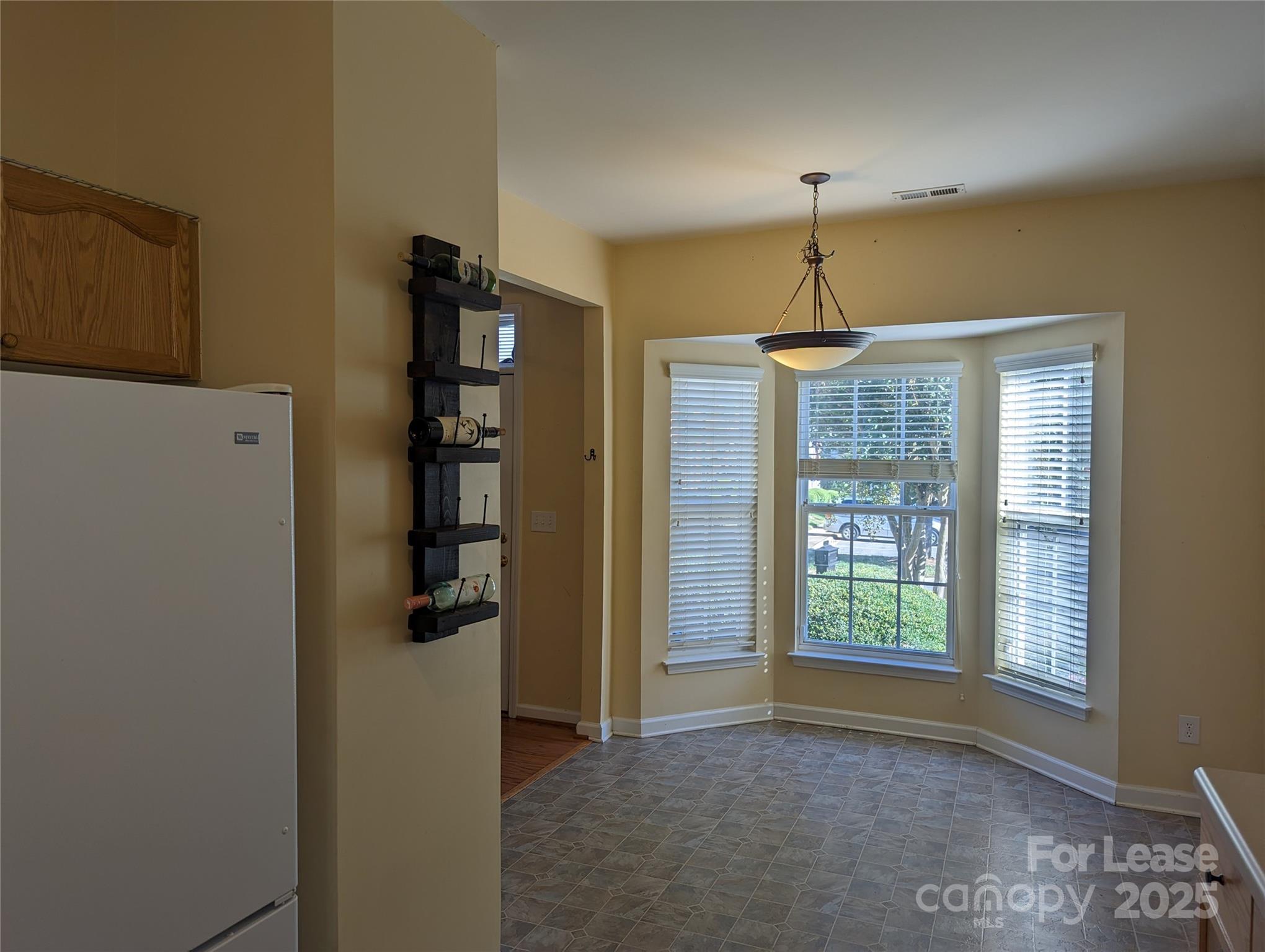 7920 Mariners Pointe Circle Denver, NC 28037 - Photo 4 of 21 a view of a kitchen with a refrigerator and window