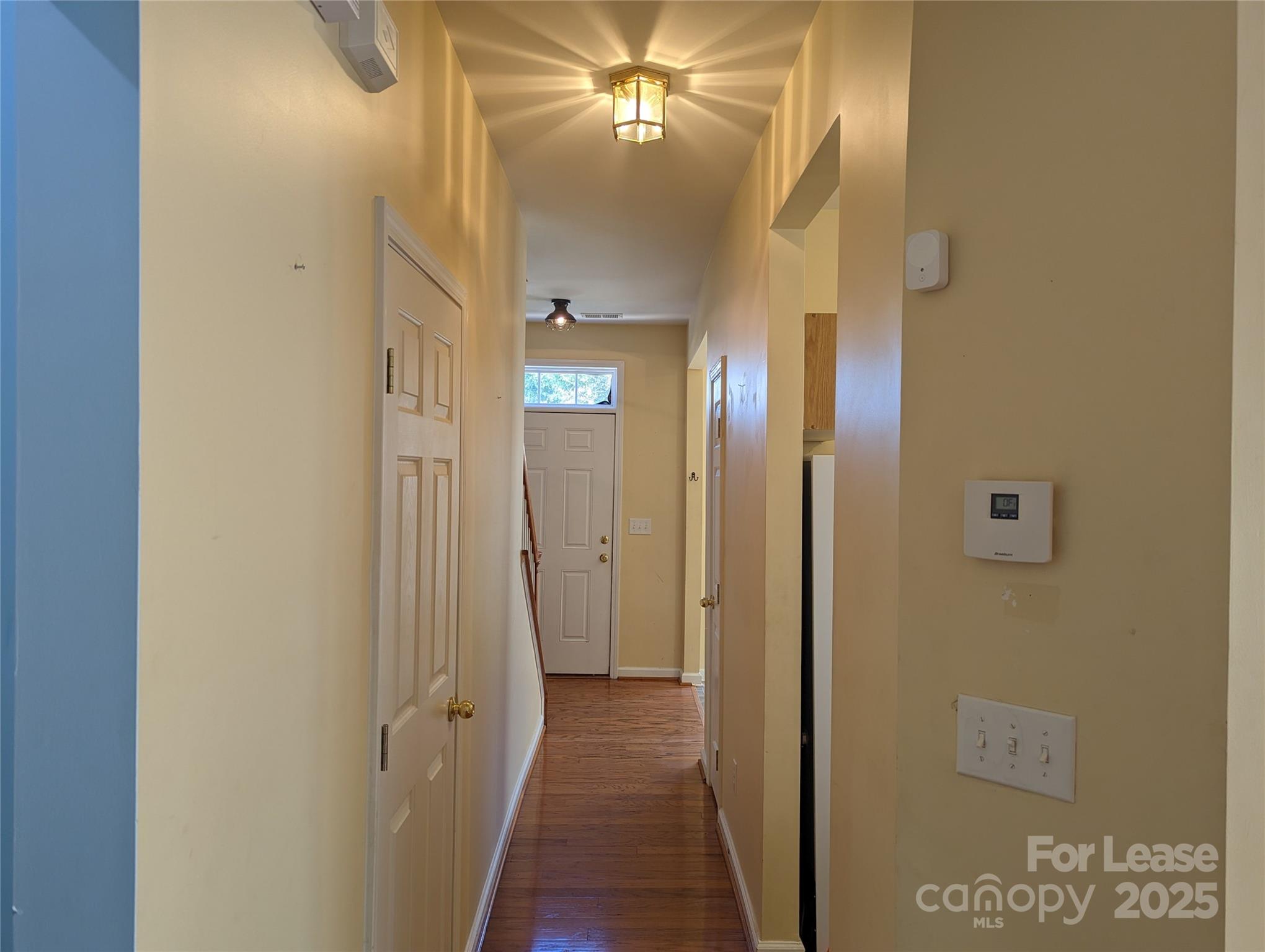7920 Mariners Pointe Circle Denver, NC 28037 - Photo 6 of 21 a view of a hallway with wooden floor