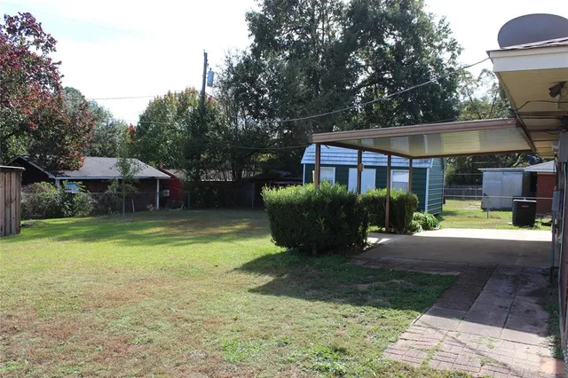 a front view of house with yard and outdoor seating
