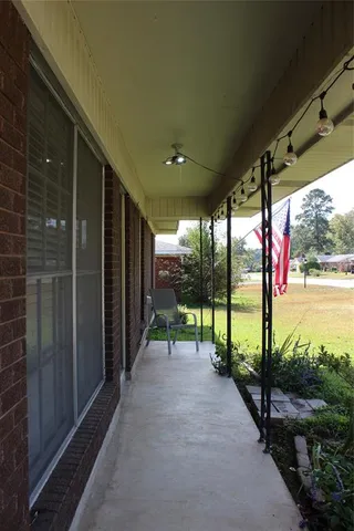 a view of swimming pool with a patio