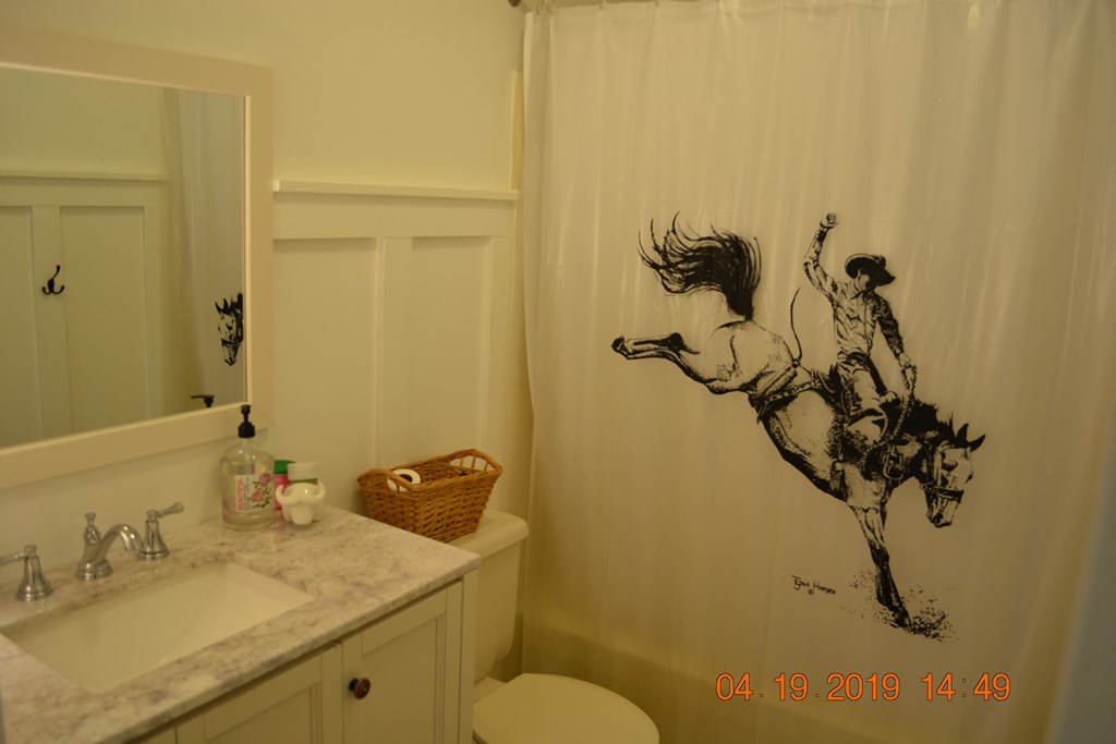 175 Kirkland Road Seale, AL 36875 - Photo 19 of 37 a bathroom with a sink and mirror with toilet