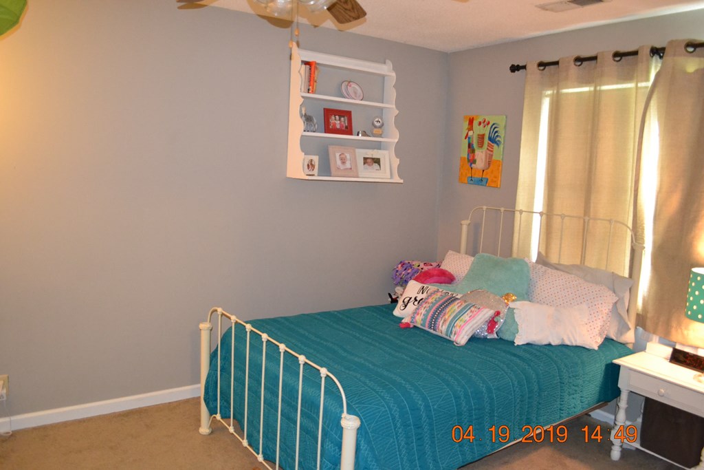 175 Kirkland Road Seale, AL 36875 - Photo 20 of 37 a bedroom with a bed and a window