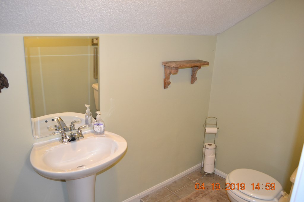 175 Kirkland Road Seale, AL 36875 - Photo 23 of 37 a bathroom with a sink and a mirror
