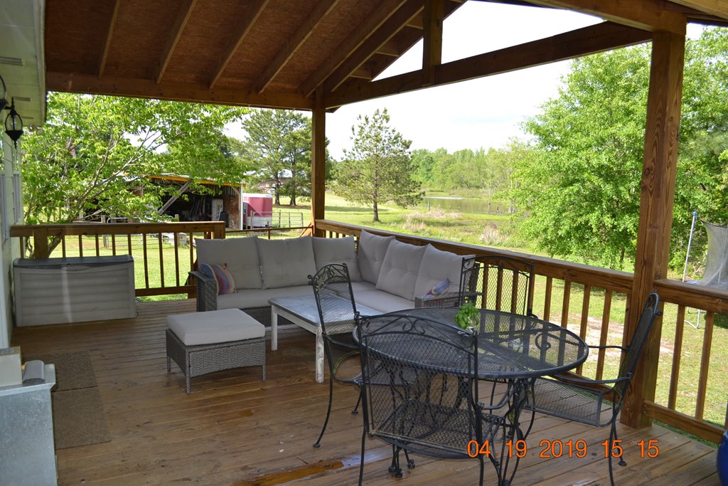 175 Kirkland Road Seale, AL 36875 - Photo 28 of 37 a view of a patio with a table chairs and a table