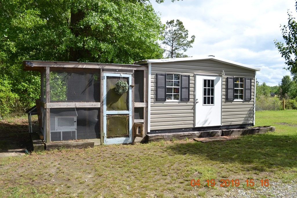 175 Kirkland Road Seale, AL 36875 - Photo 30 of 37 a house with trees in the background