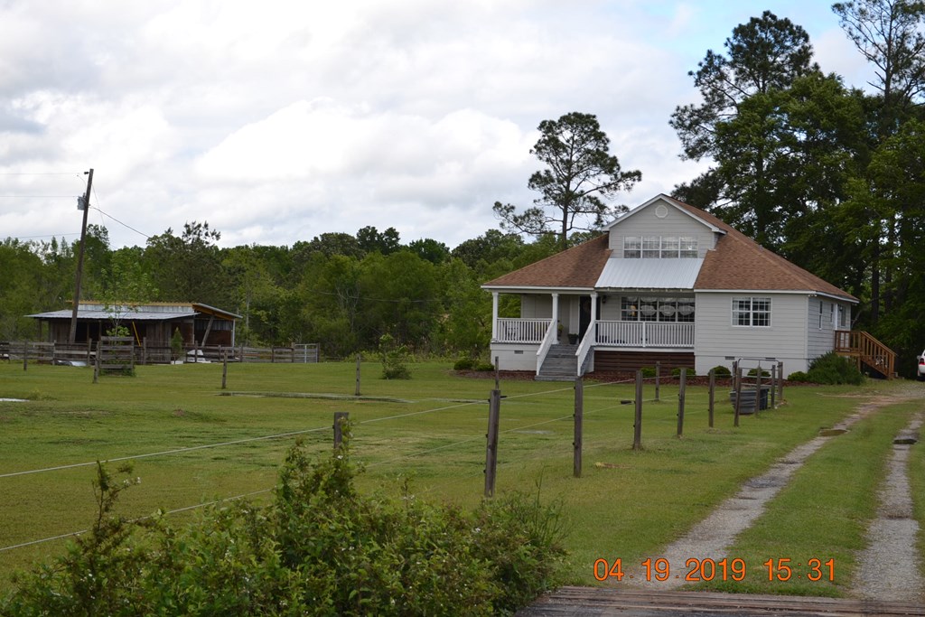 175 Kirkland Road Seale, AL 36875 - Photo 36 of 37 a front view of a house with a garden