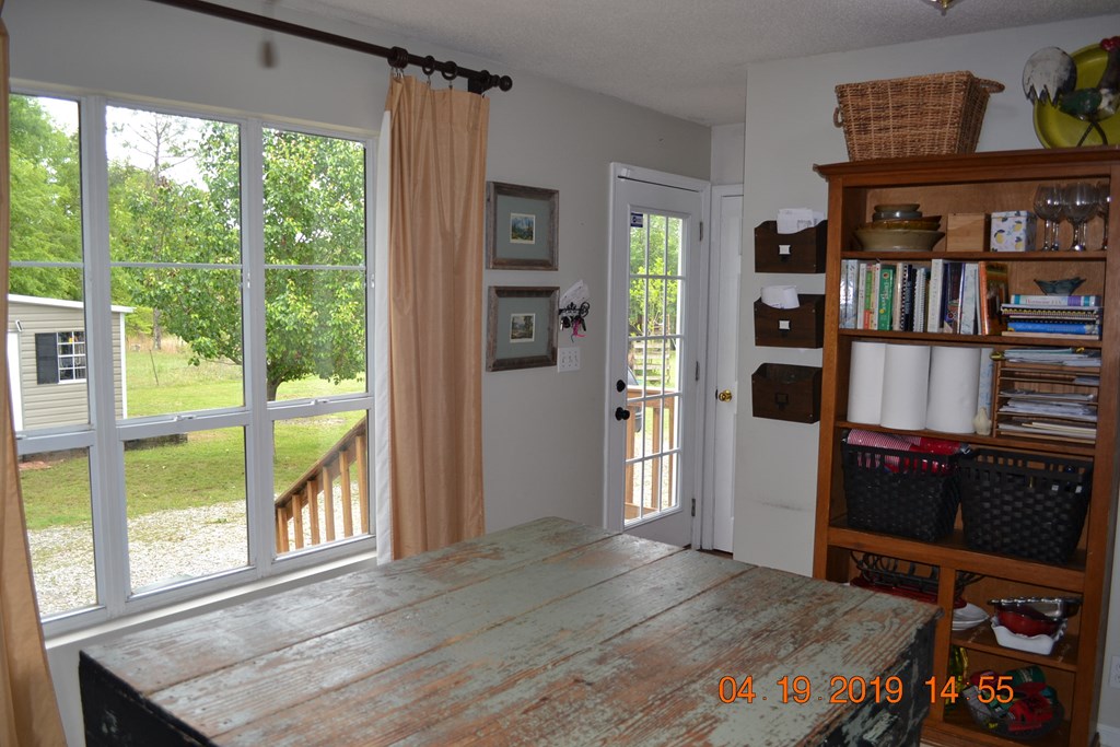 175 Kirkland Road Seale, AL 36875 - Photo 4 of 37 a bedroom with furniture and a book shelf
