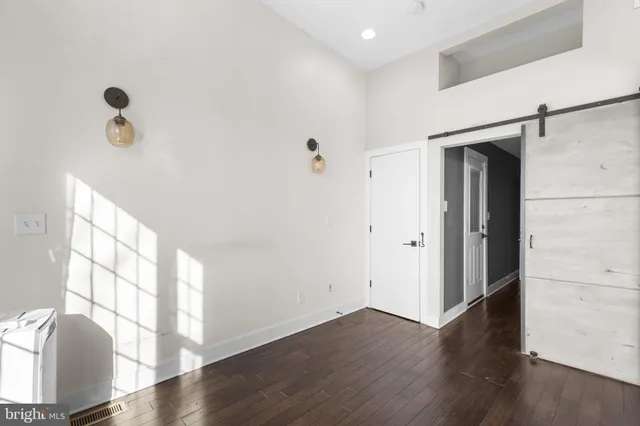 a view of entryway with wooden floor