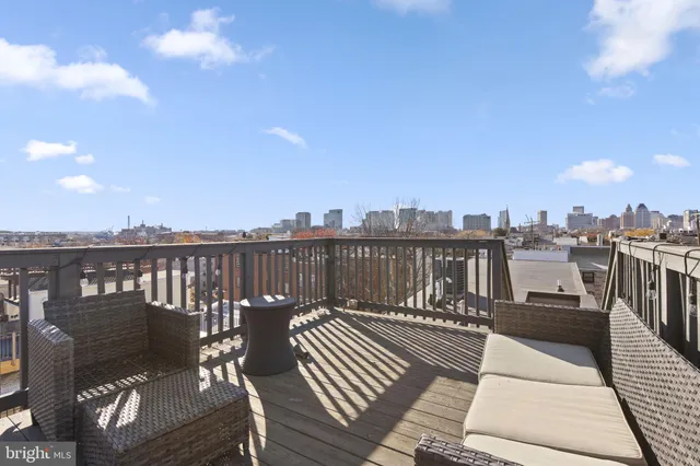 a view of a balcony with wooden floor