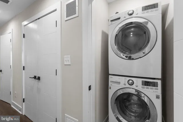 a view of a hallway with washer and dryer