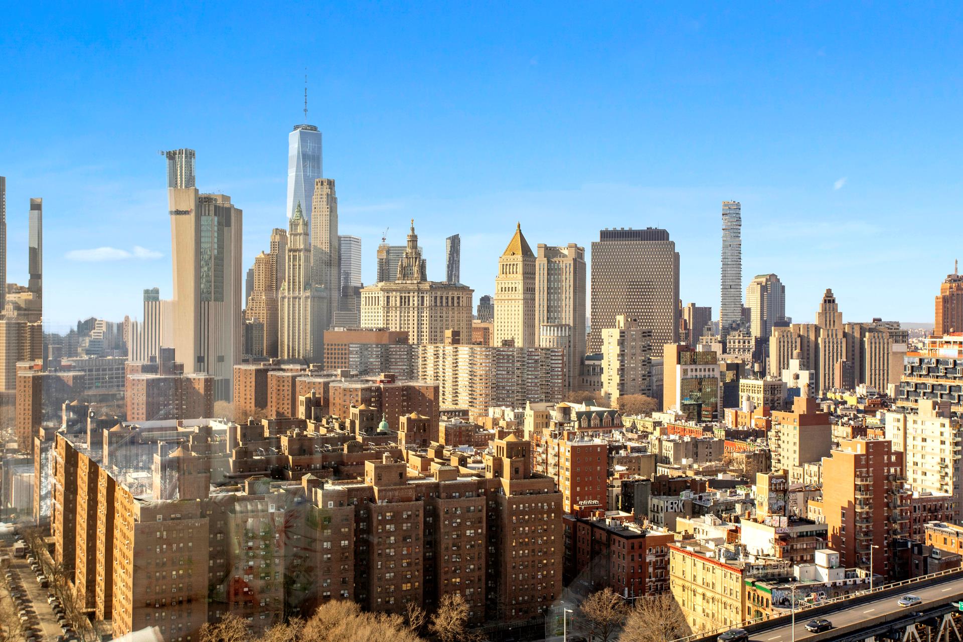 252 South Street, Unit 27M Manhattan, NY 10002 - Photo 11 of 23 a view of a city with tall buildings