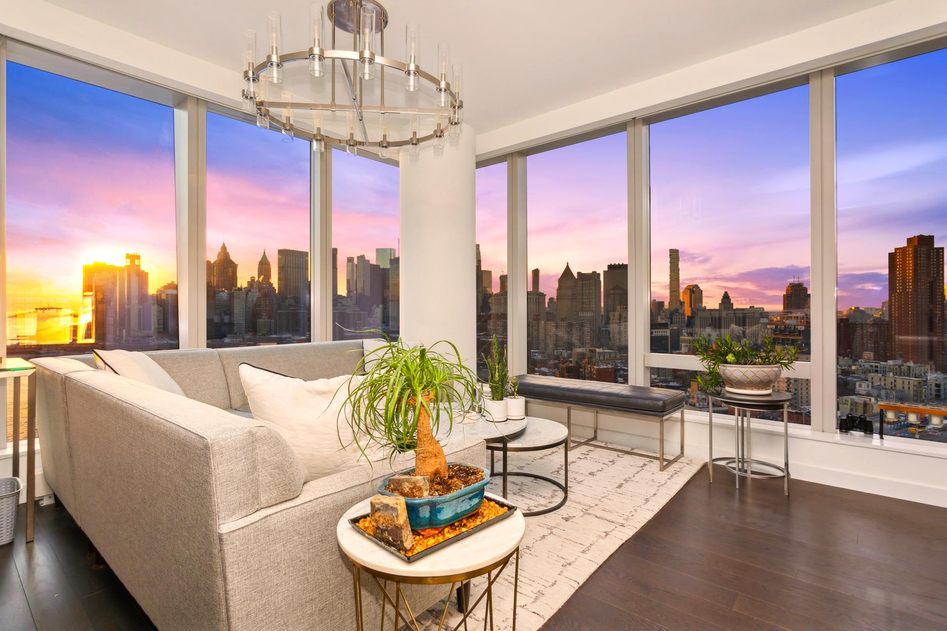 252 South Street, Unit 27M Manhattan, NY 10002 - Photo 12 of 23 a living room with furniture and a floor to ceiling window