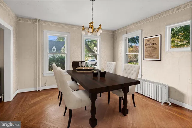 a view of a dining room with furniture window and wooden floor