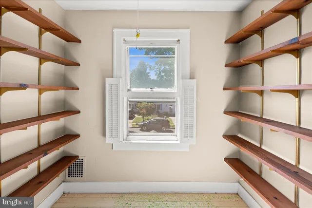 a view of staircase with wooden floor and windows