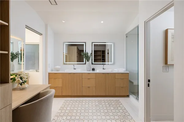 a bedroom with a bed and a lamp