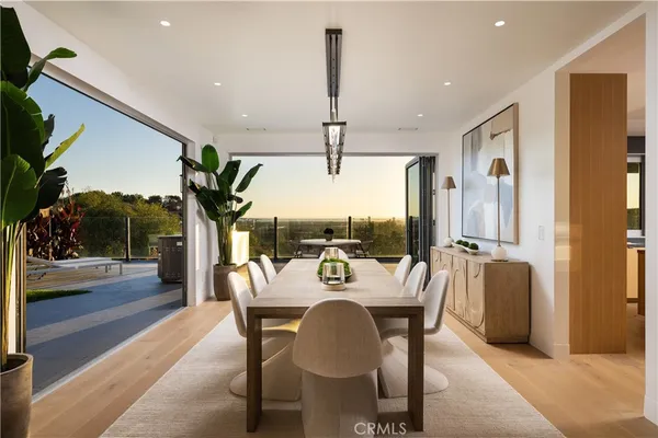 a bedroom with a large bed and a balcony view