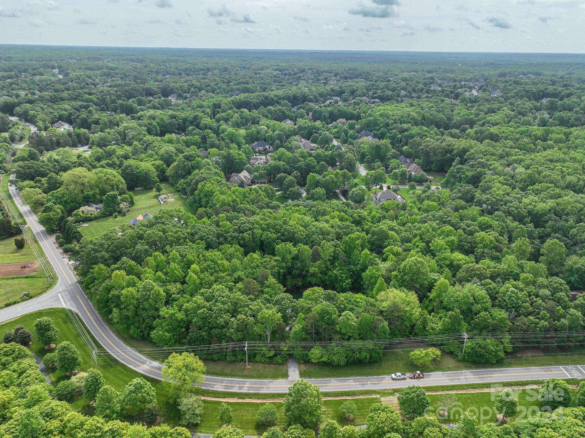 a view of a field with an trees