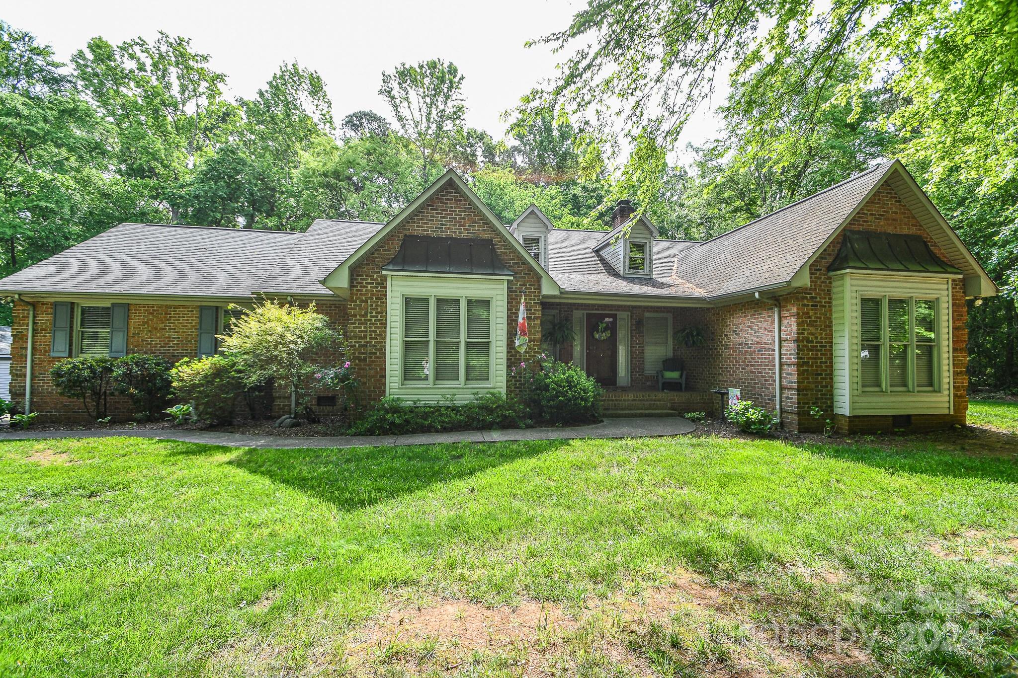 9509 Marvin School Road Marvin, NC 28173 - Photo 4 of 12 a front view of a house with a yard and green space