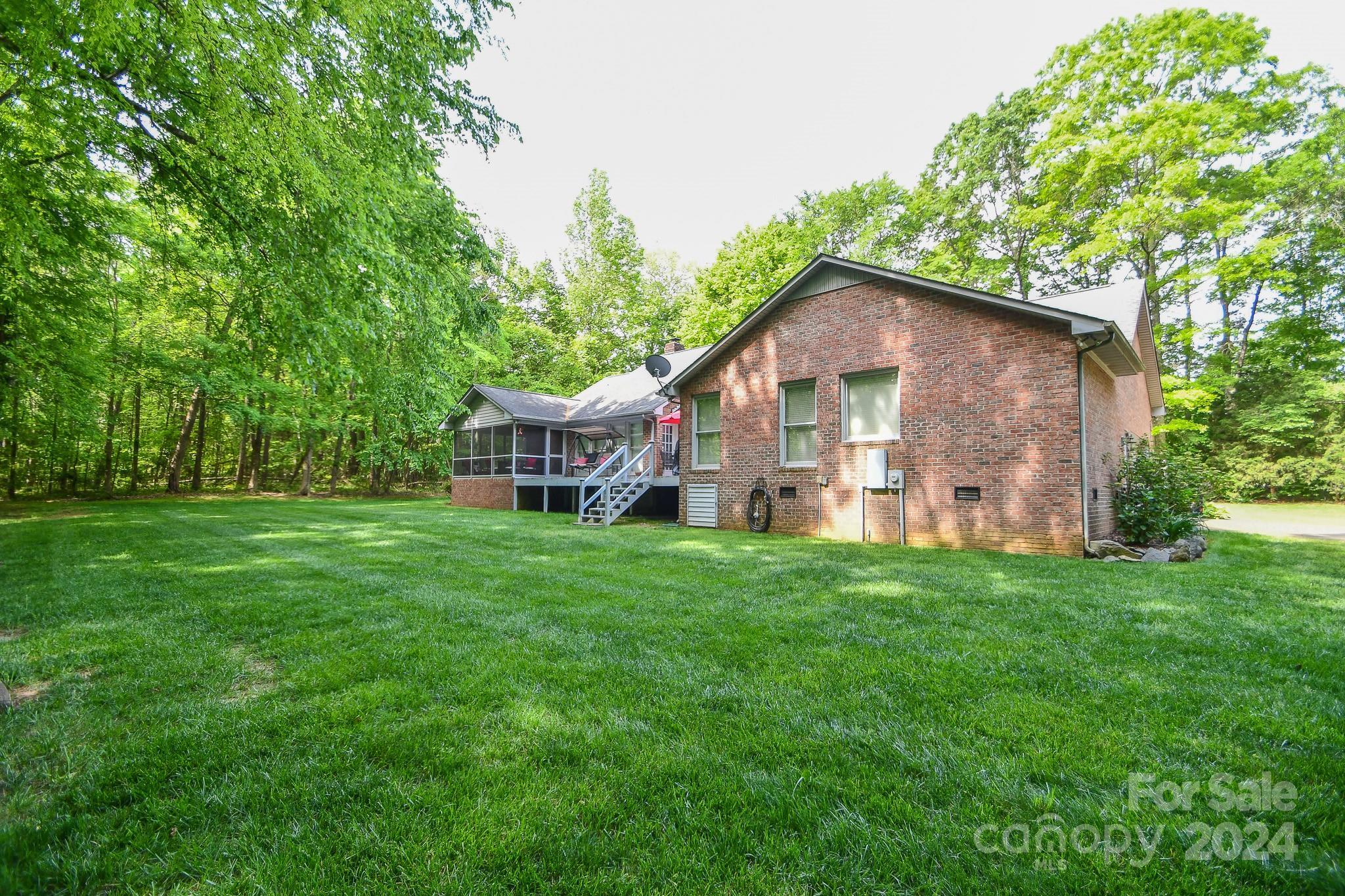9509 Marvin School Road Marvin, NC 28173 - Photo 6 of 12 a view of a house with backyard and garden