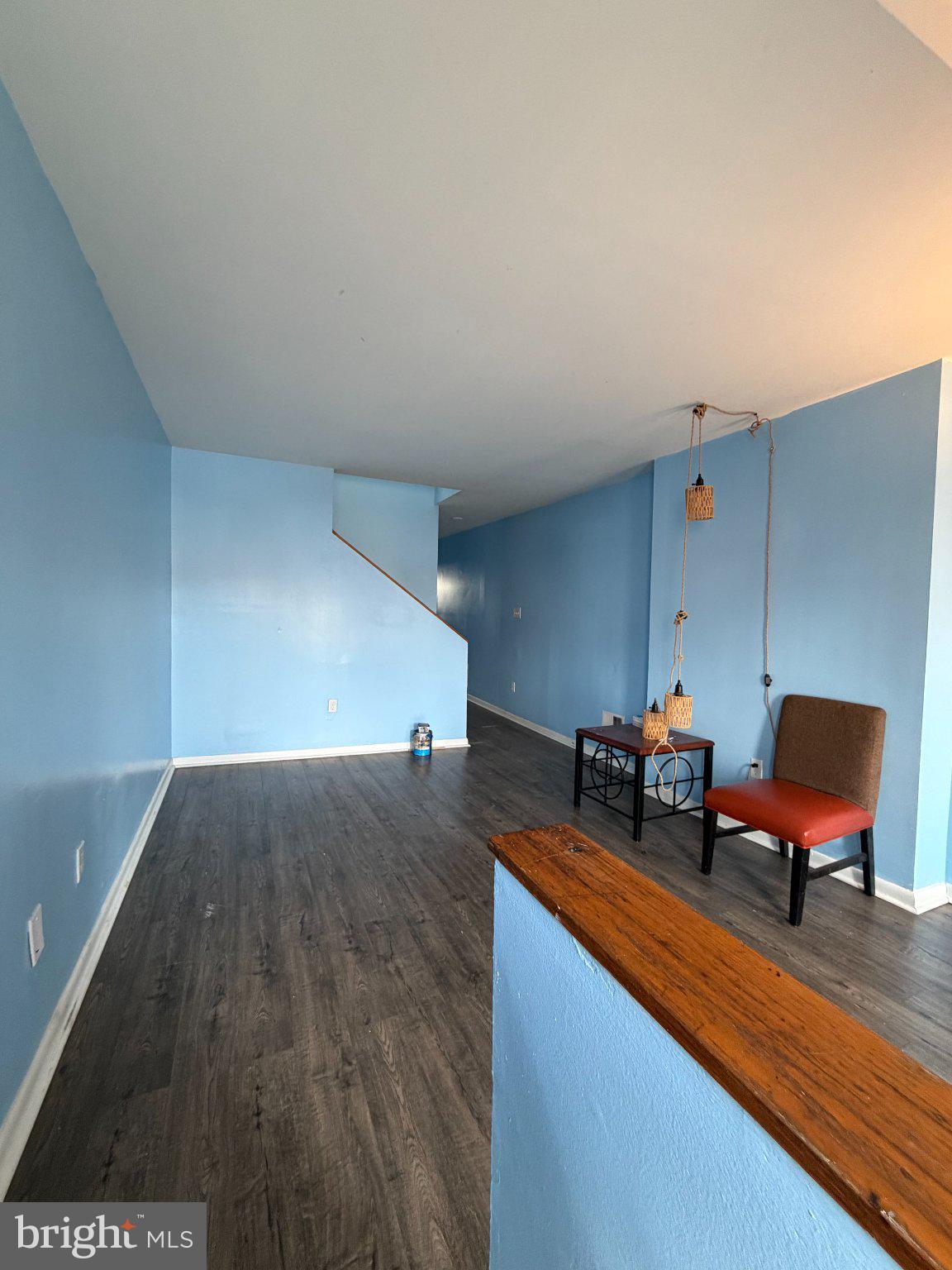 539 Gold Street Baltimore, MD 21217 - Photo 2 of 23 Spacious room with serene blue walls.