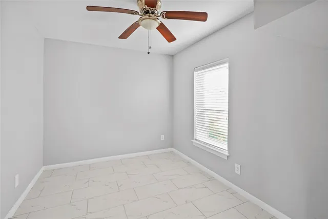a kitchen with a sink a stove and cabinets
