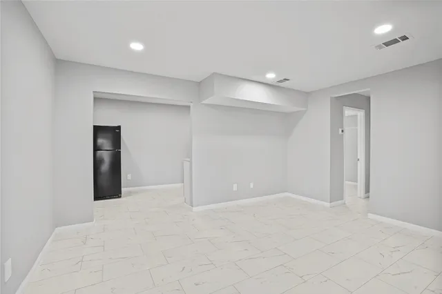 a view of a house with wooden deck and a yard