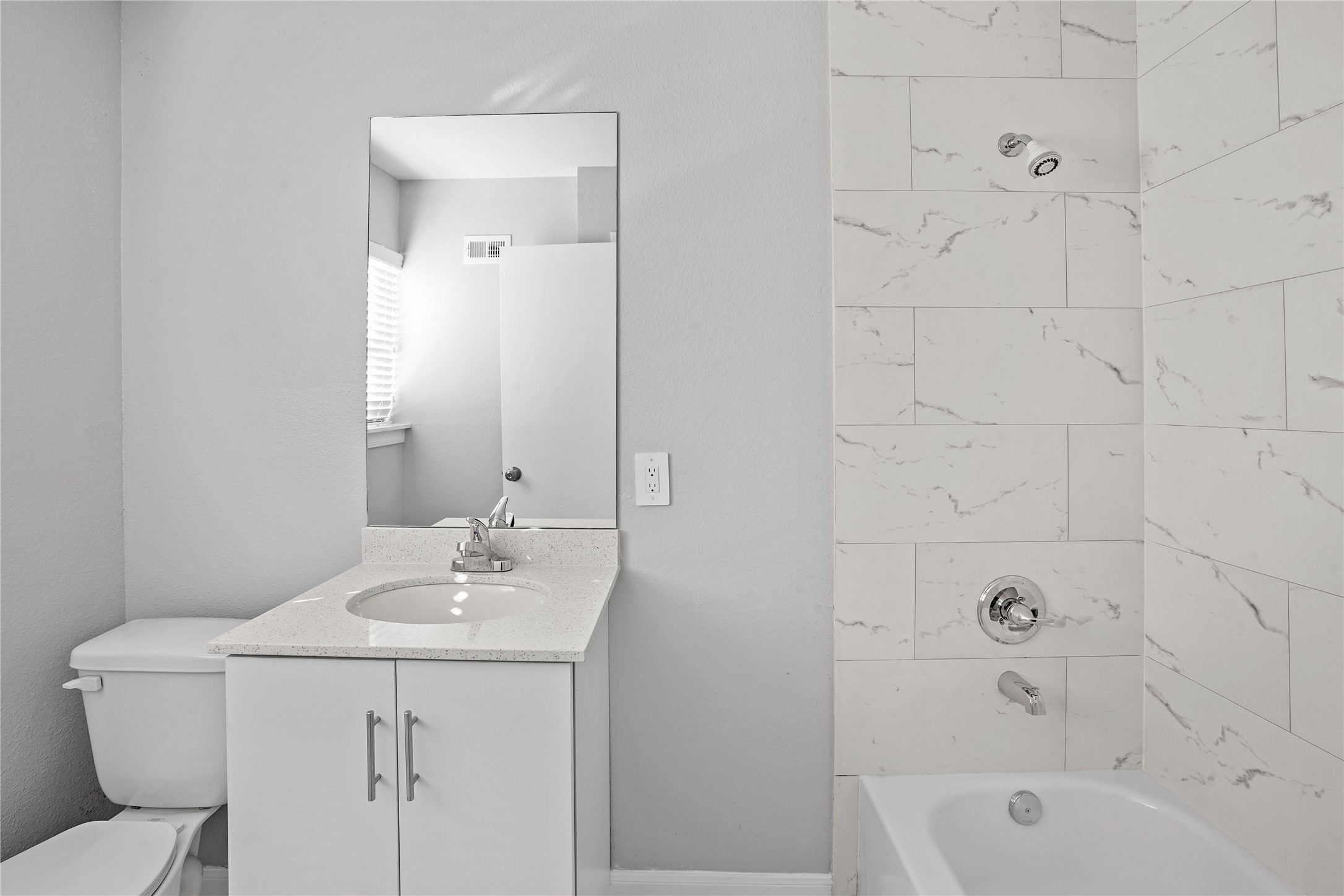 1803 Oak Street, Unit 9 La Marque, TX 77568 - Photo 6 of 12 a bathroom with a sink a toilet and shower