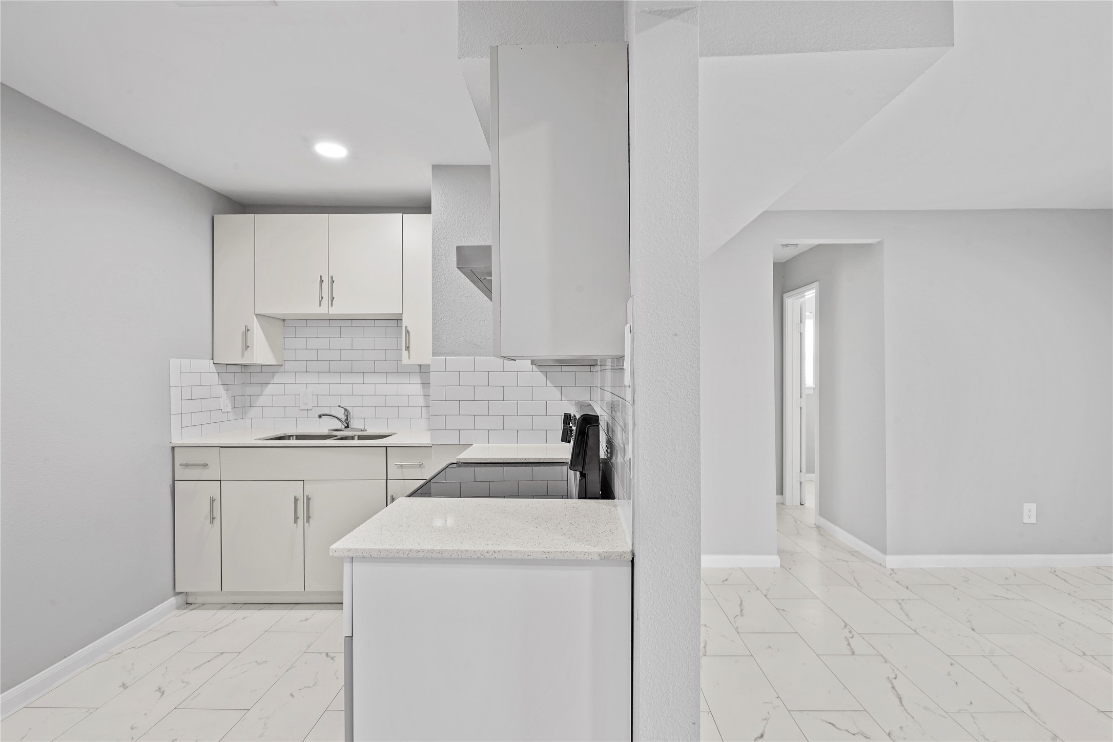 1803 Oak Street, Unit 9 La Marque, TX 77568 - Photo 8 of 12 a kitchen with a sink a stove and cabinets
