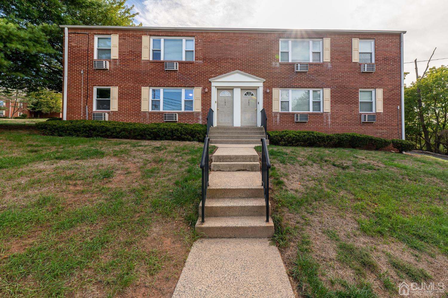 a front view of a house with yard