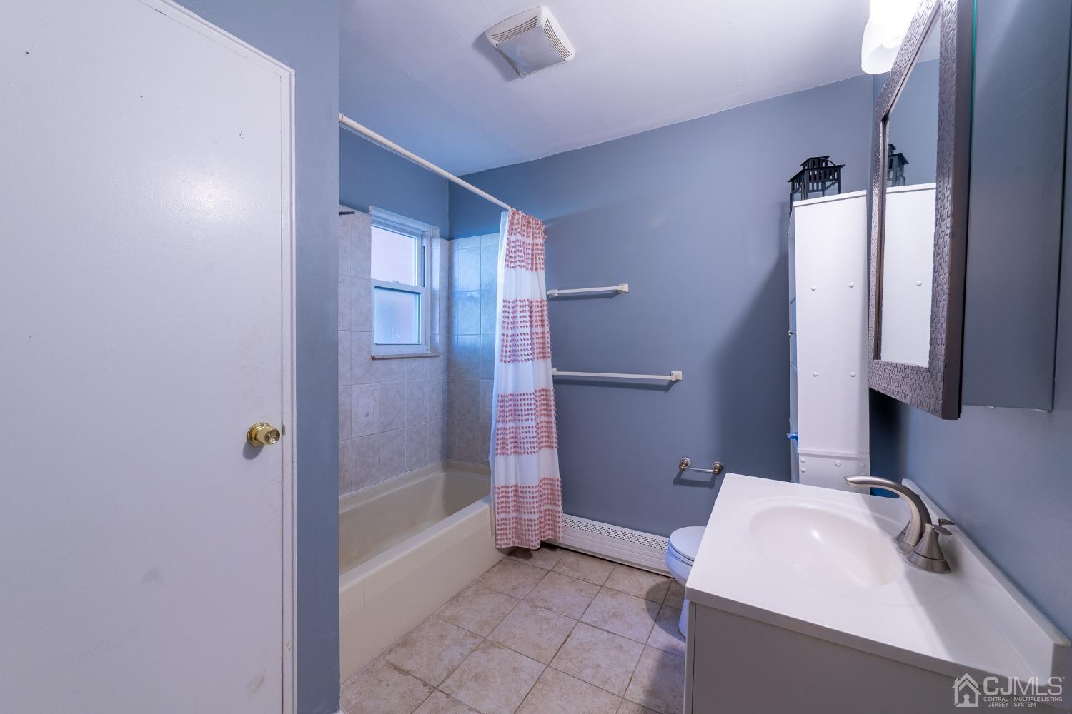 93 Fox Road, Unit 7A Edison, NJ 08817 - Photo 15 of 21 a bathroom with a sink a toilet and shower