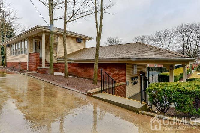 93 Fox Road, Unit 7A Edison, NJ 08817 - Photo 16 of 21 a view of a house with pool and chairs