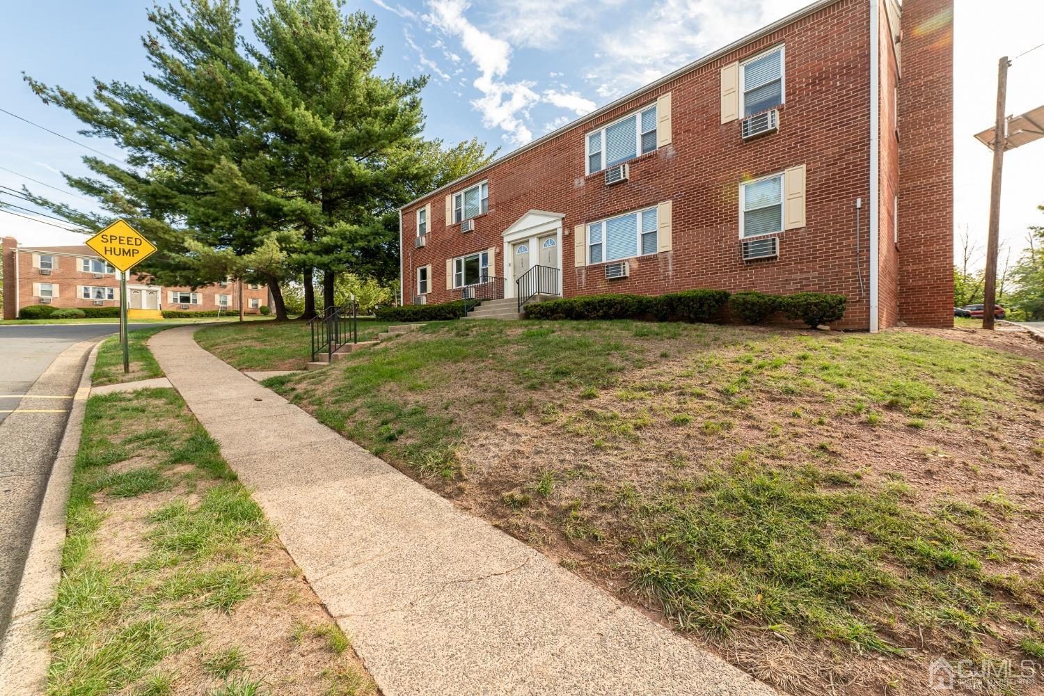 93 Fox Road, Unit 7A Edison, NJ 08817 - Photo 2 of 21 a view of yard with large trees