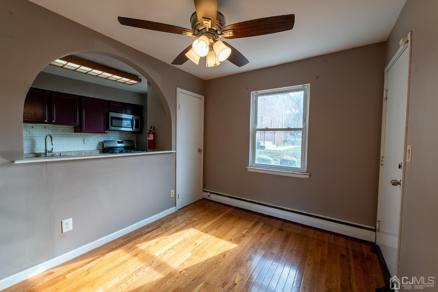 93 Fox Road, Unit 7A Edison, NJ 08817 - Photo 7 of 21 a view of a livingroom with a kitchen and a window