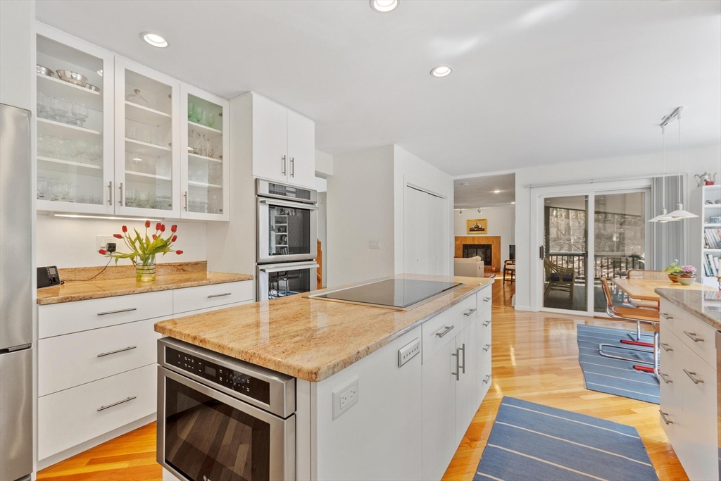 781 Strawberry Hill Road Concord, MA 01742 - Photo 11 of 42 a kitchen with granite countertop a stove and a sink