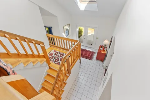 a view of an entryway with wooden floor