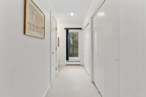 a bedroom with a bed and dresser