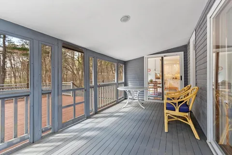 a front view of a house with a deck